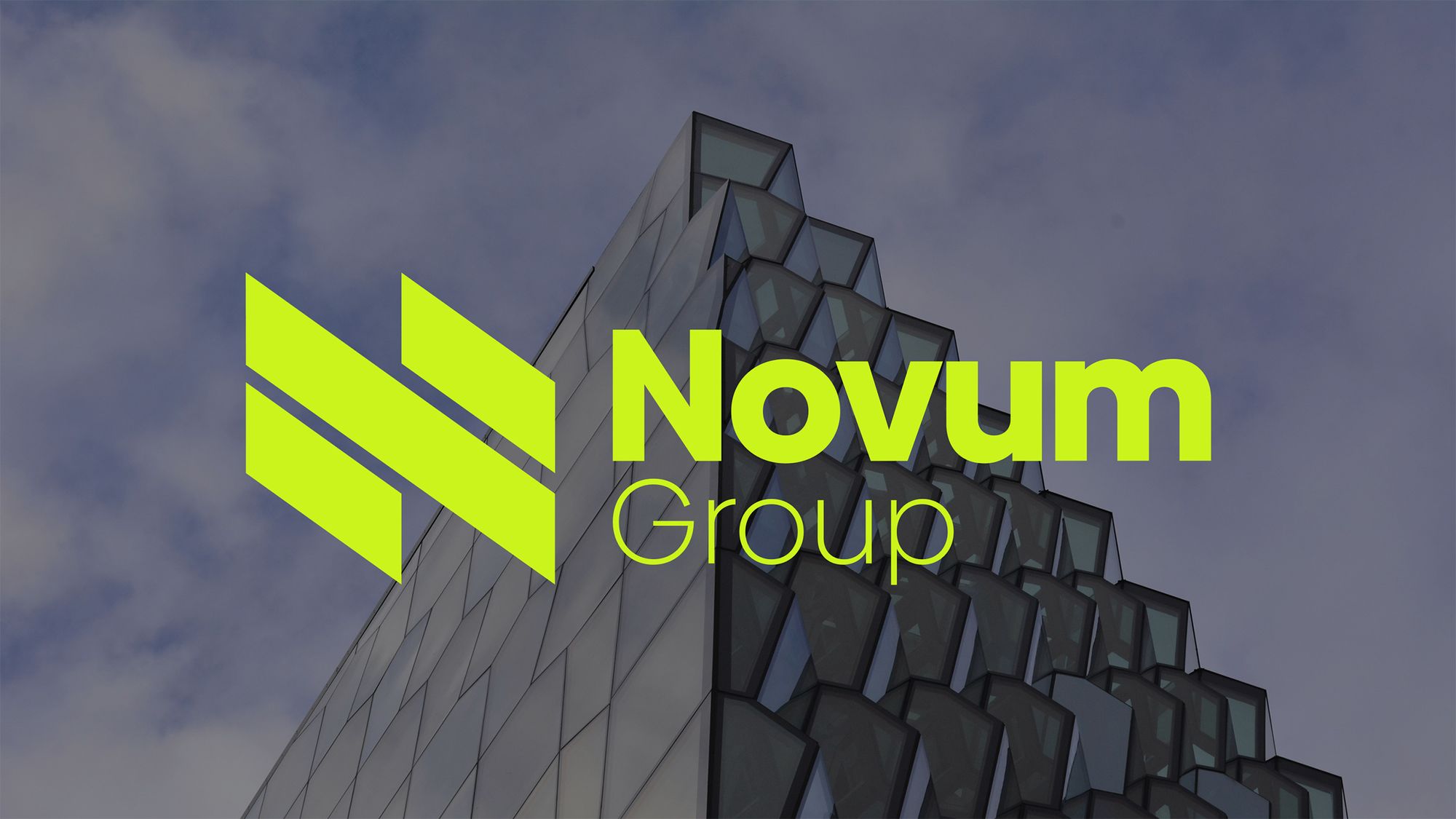 Novum Group logo in neon green over a glass office building